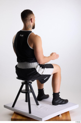 Whole Body Man White Sports Shorts Slim Athletic Sitting Top Studio photo references